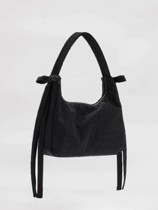 Nueva tendencia de moda, bolso sencillo tipo axila. 