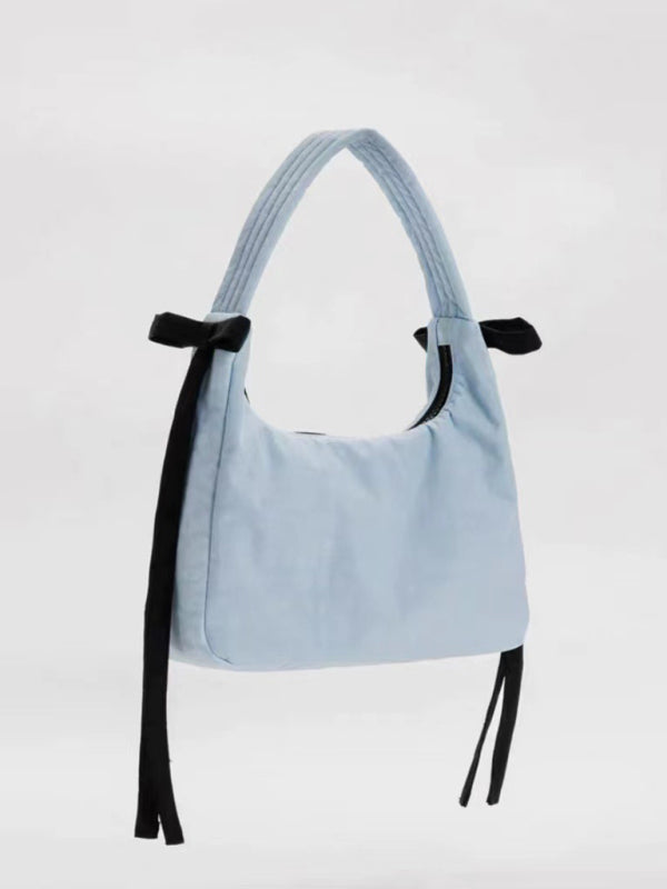 Nueva tendencia de moda, bolso sencillo tipo axila. 