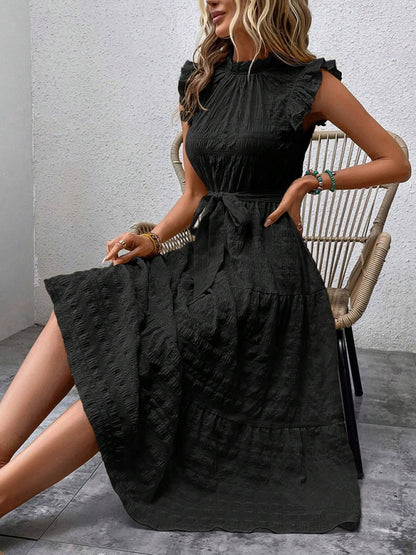 Nuevo vestido texturizado con cordones y mangas voladoras con volantes 
