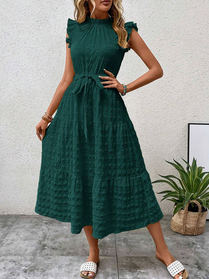 Nuevo vestido texturizado con cordones y mangas voladoras con volantes 
