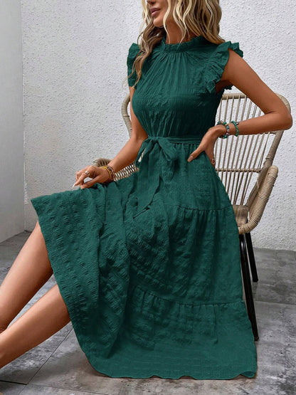 Nuevo vestido texturizado con cordones y mangas voladoras con volantes 