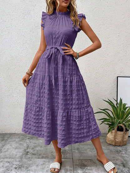Nuevo vestido texturizado con cordones y mangas voladoras con volantes 