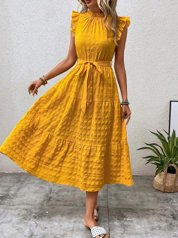Nuevo vestido texturizado con cordones y mangas voladoras con volantes 