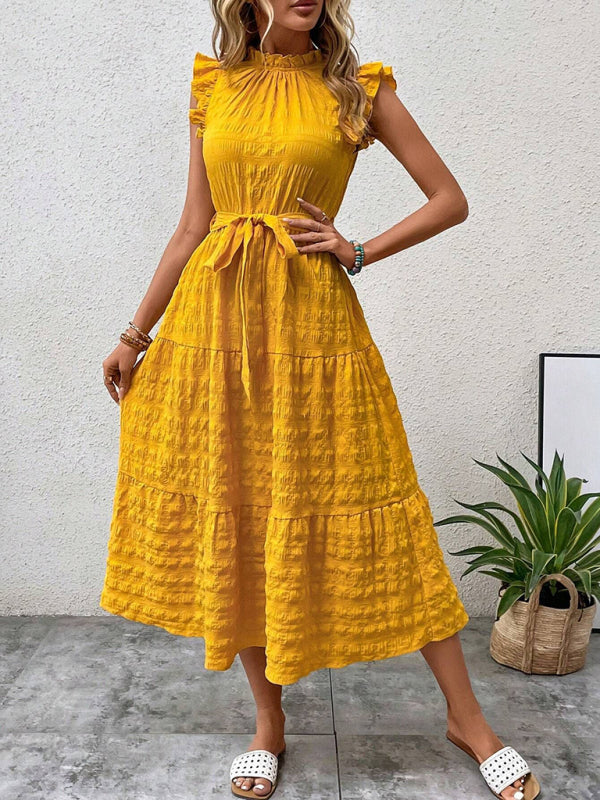 Nuevo vestido texturizado con cordones y mangas voladoras con volantes 